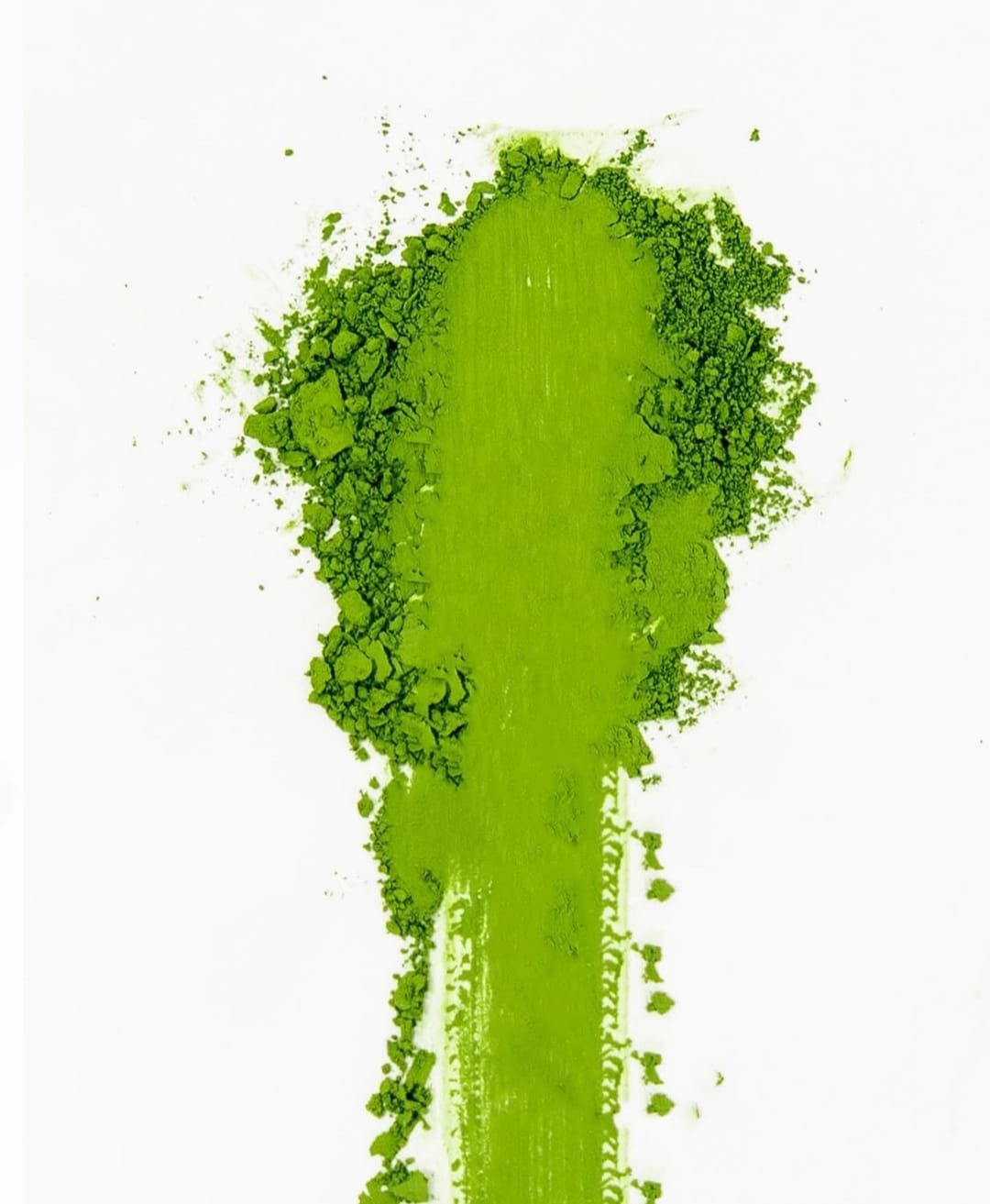 Box of Inika Health Matcha green tea powder on a white surface with decorative elements.